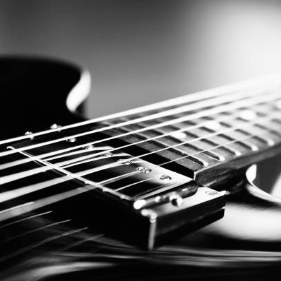 Extreme Close up shot of an electric guitar in Black and White - selective focus